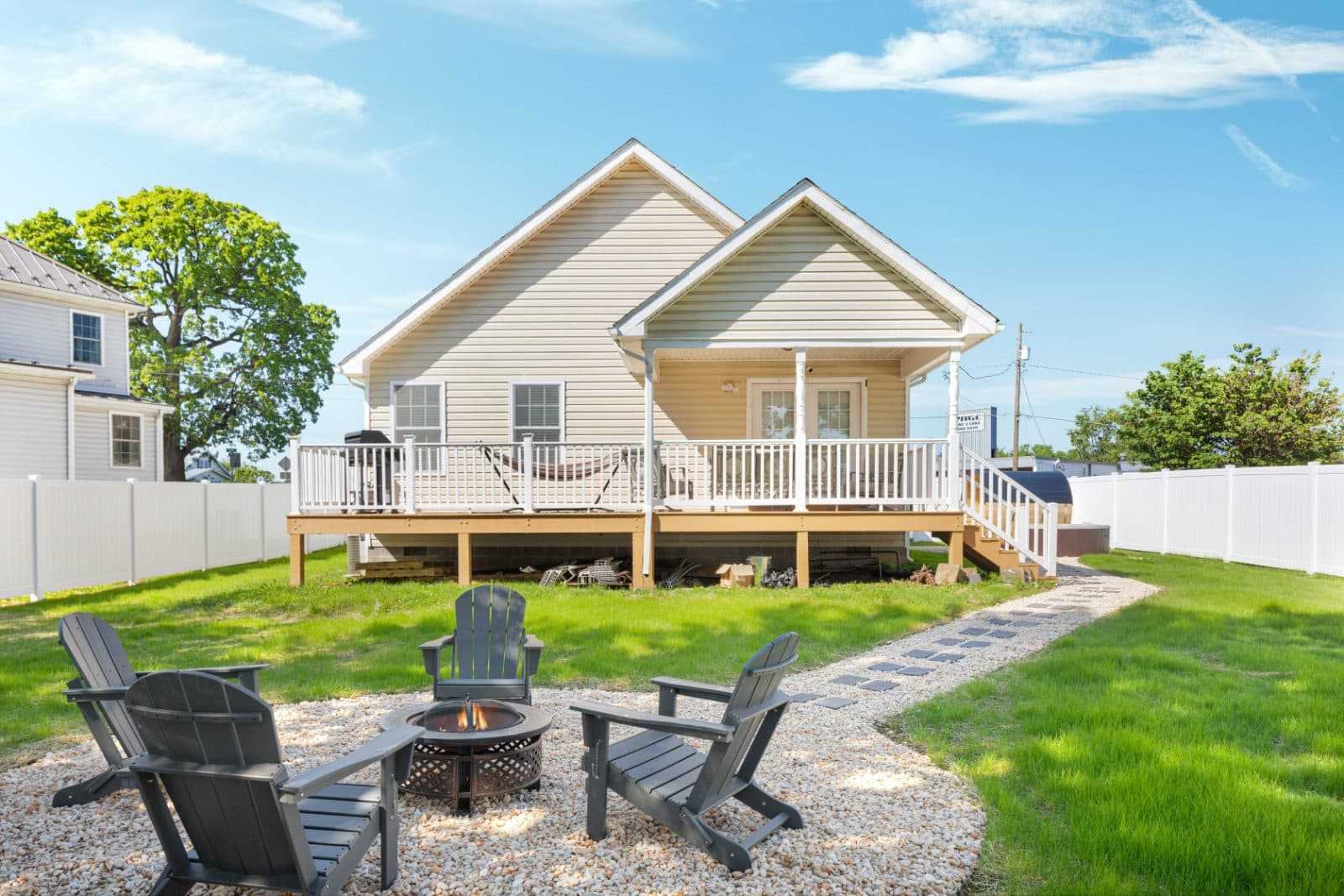 Backyard with deck and fire pit area at Heart of Luray vacation rental