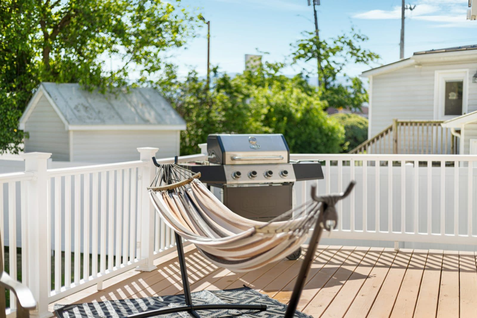 Gas grill and hammock on the covered deck at Heart of Luray